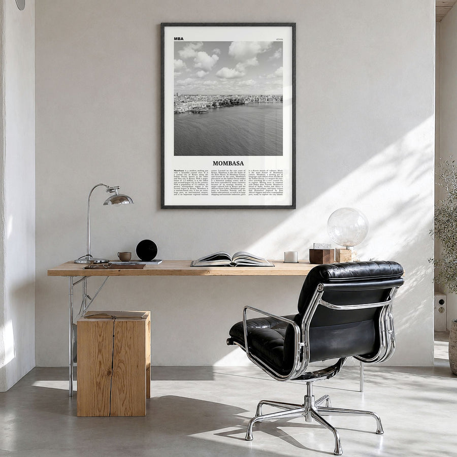 Mombasa Newspaper Poster in a black wood frame, hanging in a bright home office