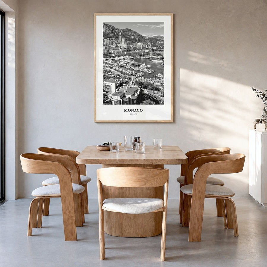 Monaco Classic Poster in a natural wood frame, hanging in a dining room