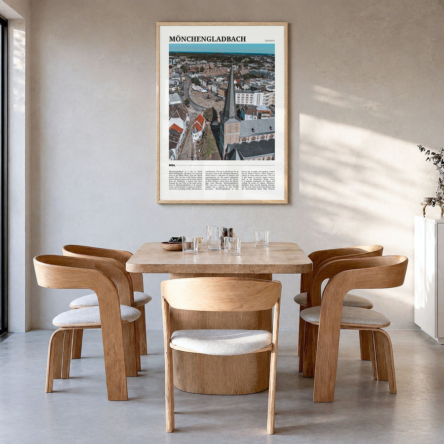 Mönchengladbach Travel Poster in a natural wood frame, hanging in a dining room