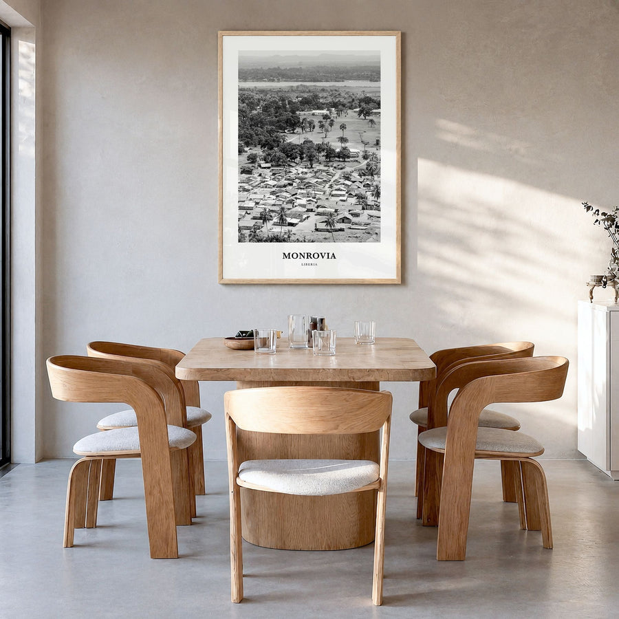Monrovia Classic Poster in a natural wood frame, hanging in a dining room