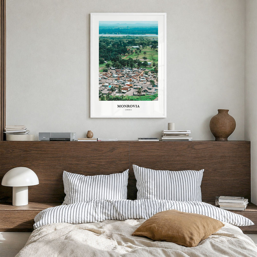 Monrovia Classic No 2 Poster in a white wood frame, hanging in a bedroom