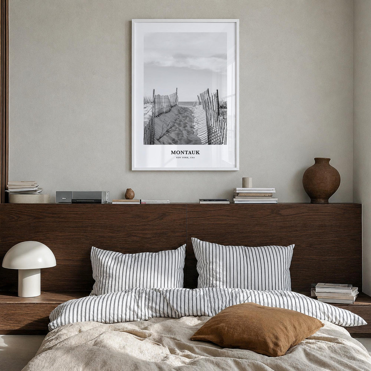 Montauk no. 2 black & white classic poster of New York, USA – vertical wall art in white wood frame, hanging on wall