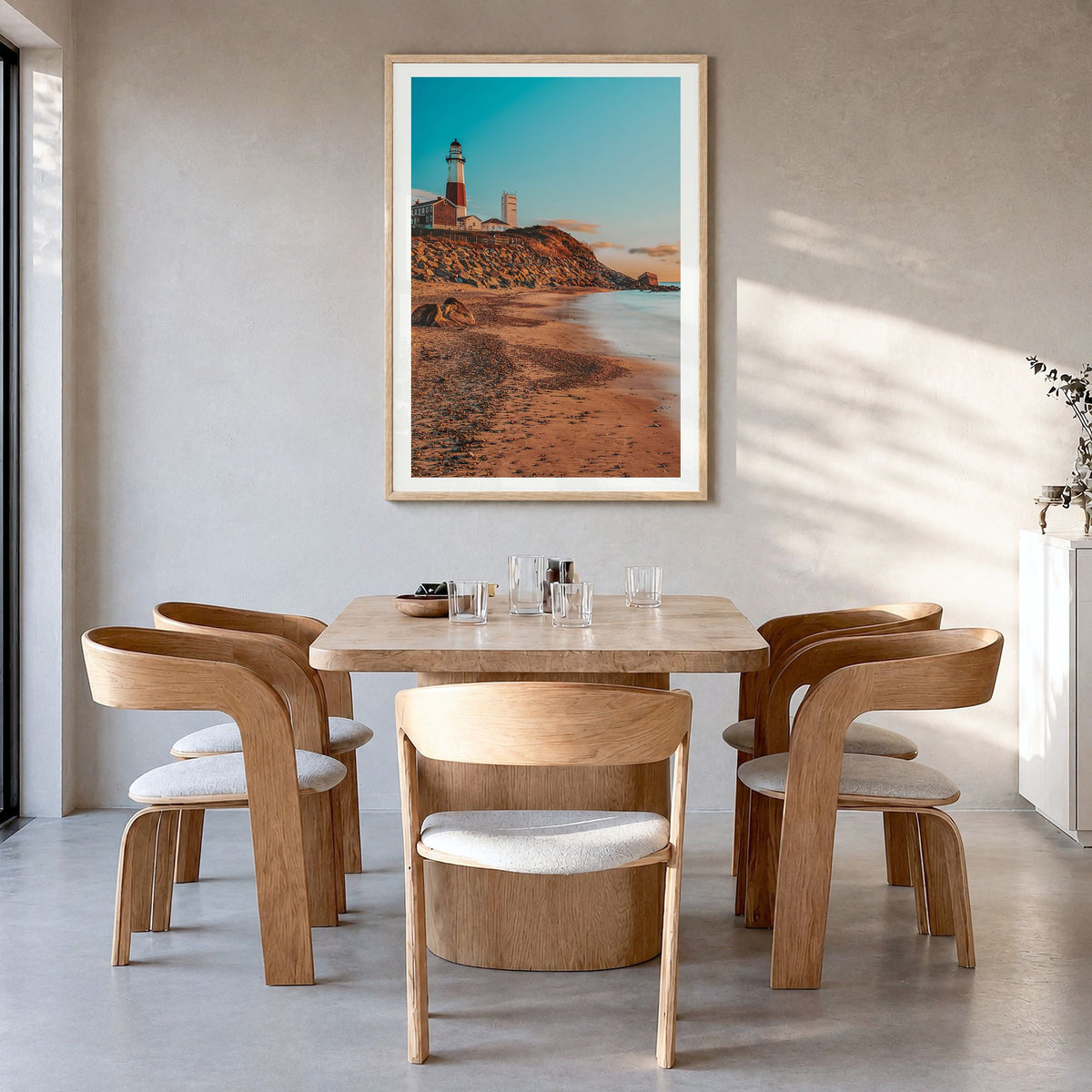 Montauk Photo No 1 Poster in a natural wood frame, hanging in a dining room, white border