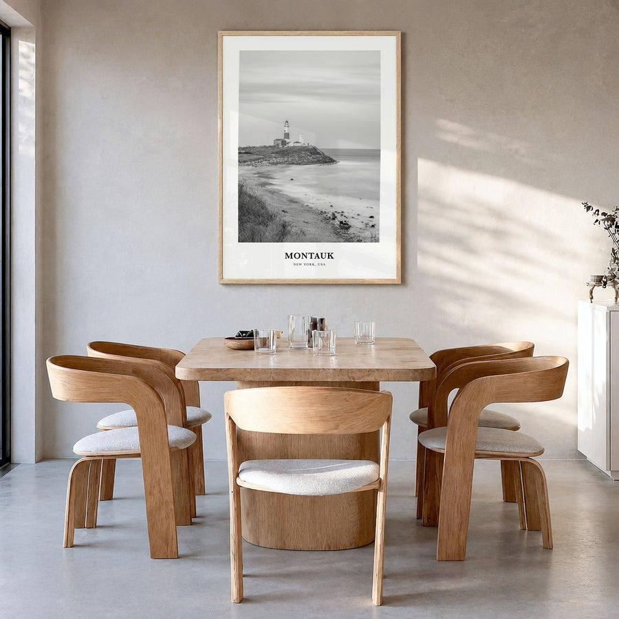 Montauk Classic No 1 Poster in a natural wood frame, hanging in a dining room