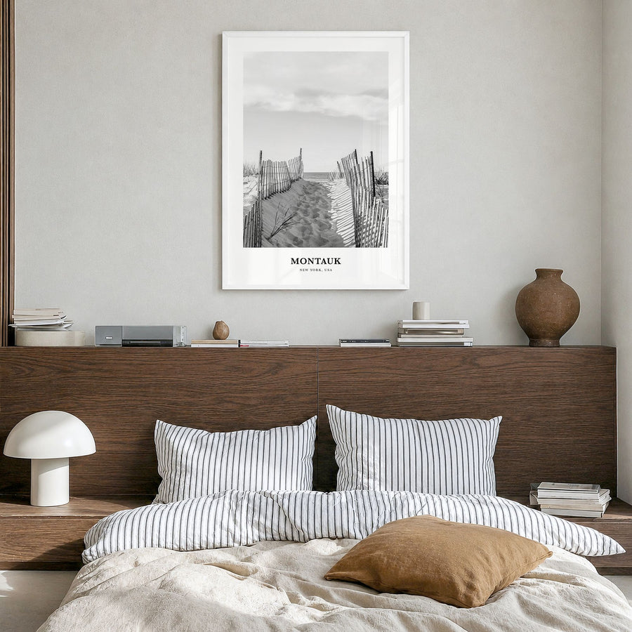Montauk Classic No 2 Poster in a white wood frame, hanging in a bedroom