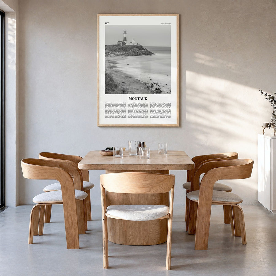 Montauk Newspaper No 2 Poster in a natural wood frame, hanging in a dining room