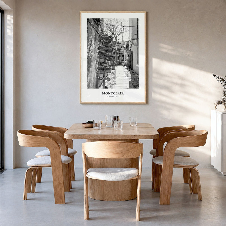 Montclair Classic Poster in a natural wood frame, hanging in a dining room