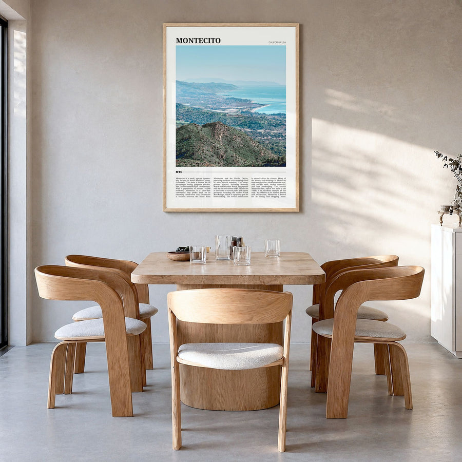 Montecito Travel Poster in a natural wood frame, hanging in a dining room