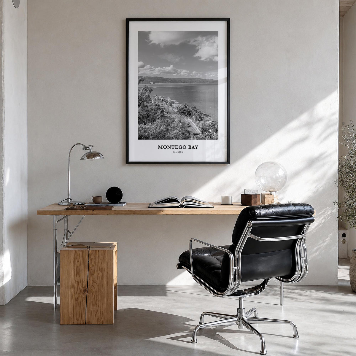 Montego Bay black & white classic poster of Jamaica – vertical wall art in black wood frame, hanging on wall