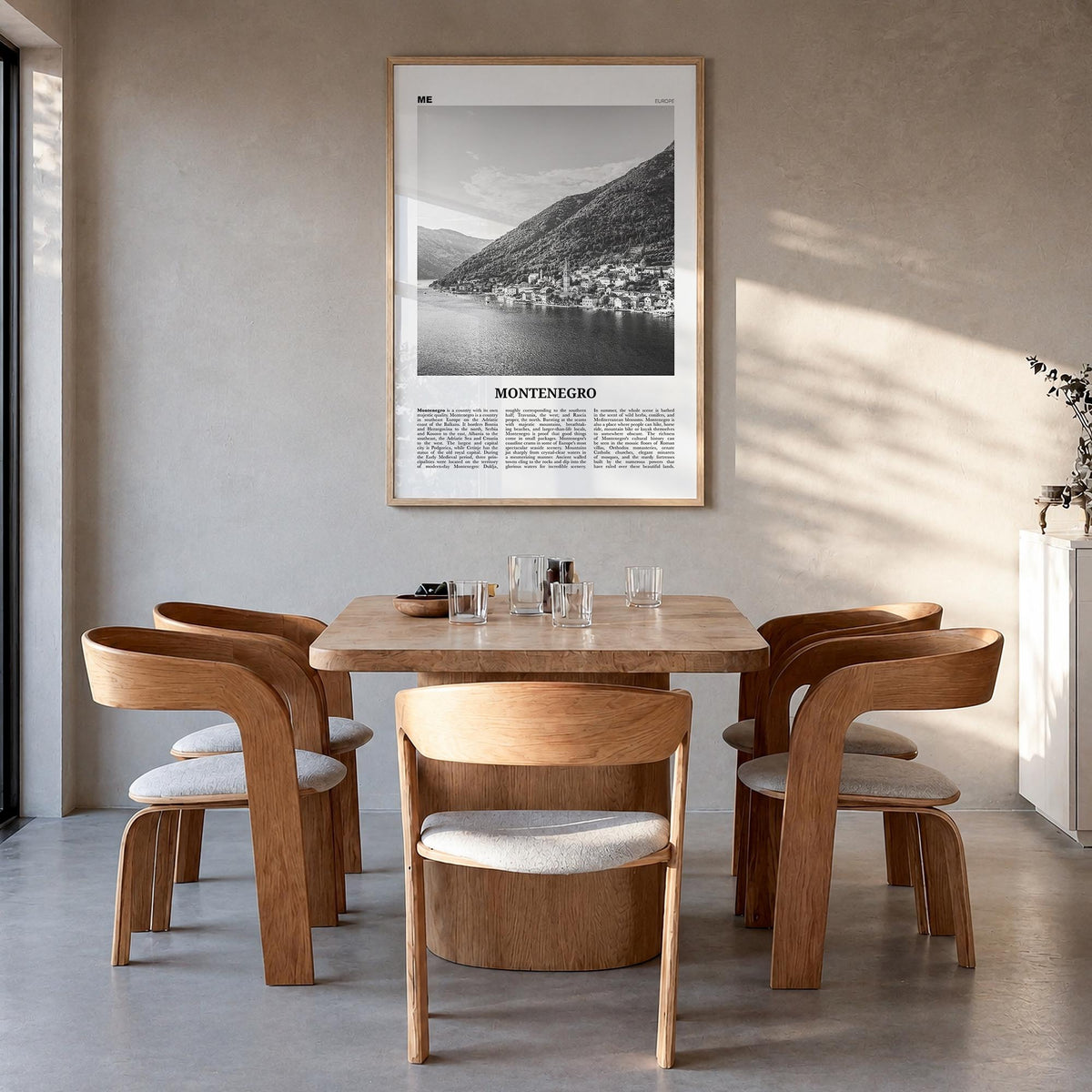 Montenegro black & white newspaper poster of Europe – vertical wall art in natural wood frame, hanging on wall