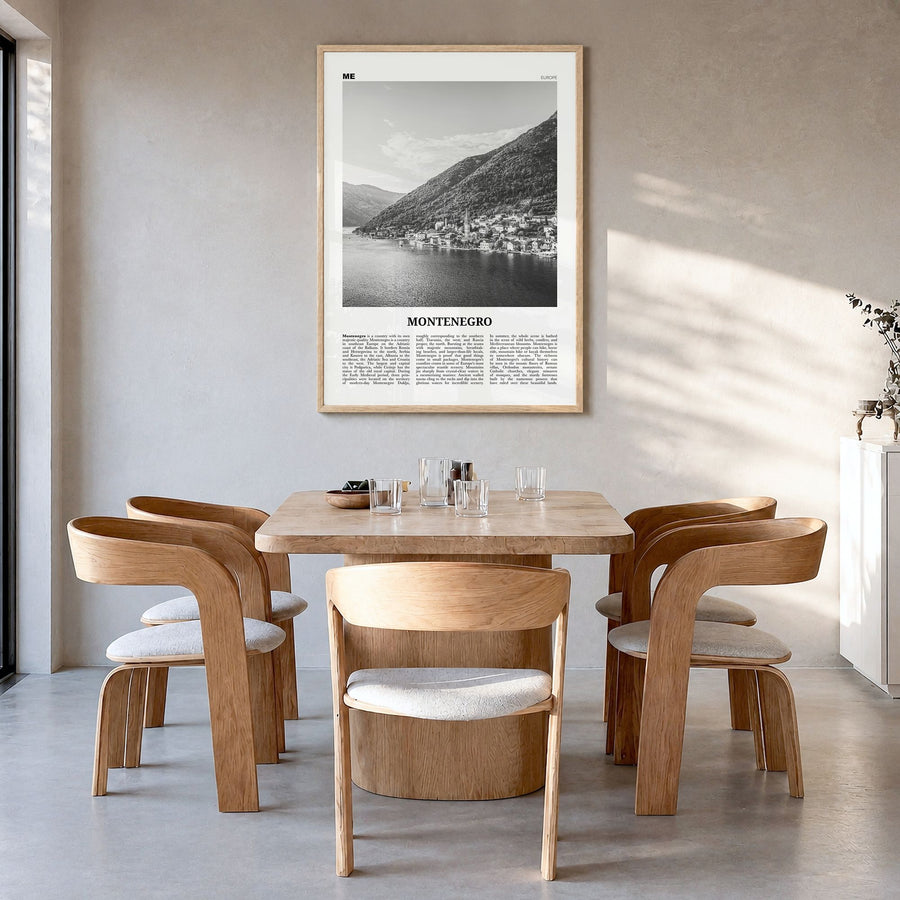 Montenegro Newspaper Poster in a natural wood frame, hanging in a dining room