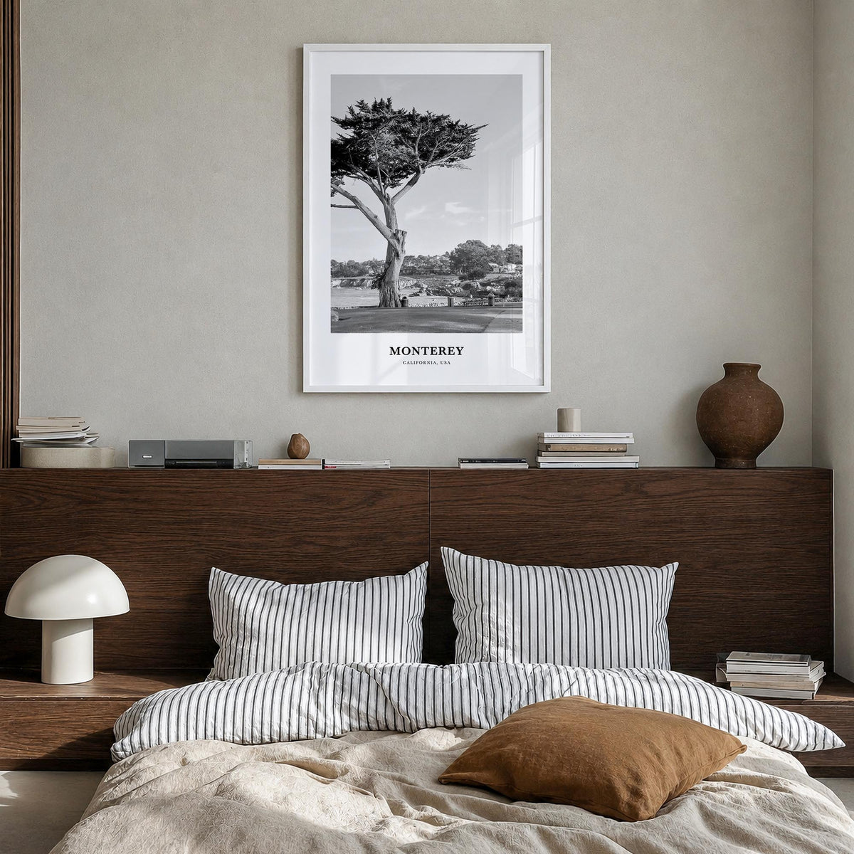 Monterey black & white classic poster of California, USA – vertical wall art in white wood frame, hanging on wall