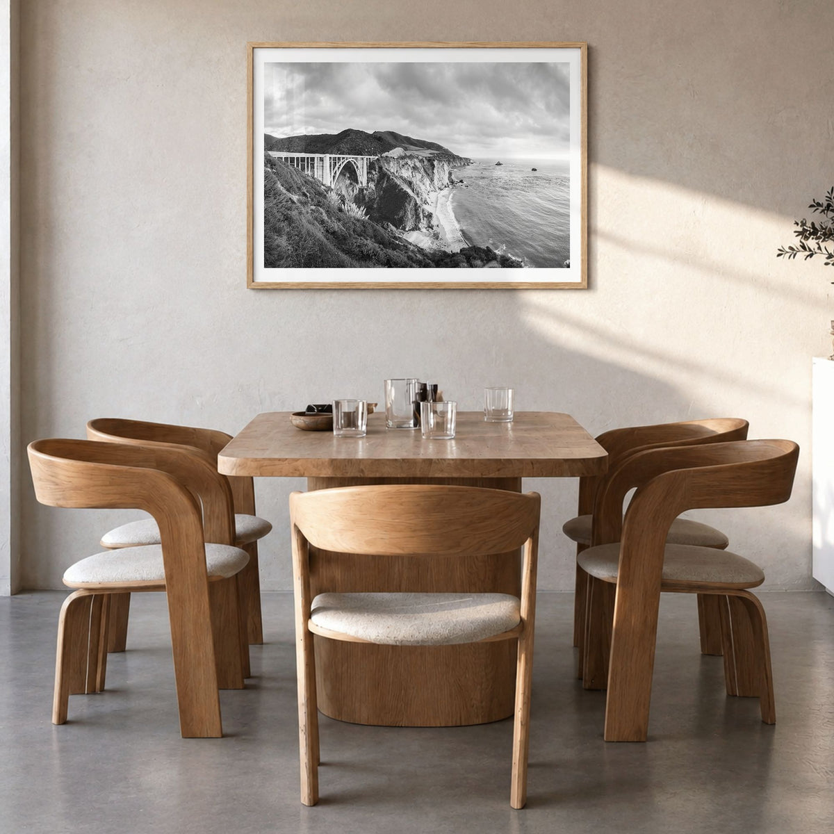 Monterey, California Photo Poster in a natural wood frame, hanging in a dining room, white border