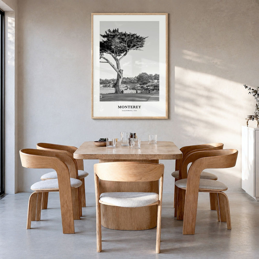 Monterey, California Classic Poster in a natural wood frame, hanging in a dining room