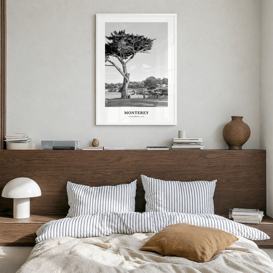 Monterey, California Classic Poster in a white wood frame, hanging in a bedroom