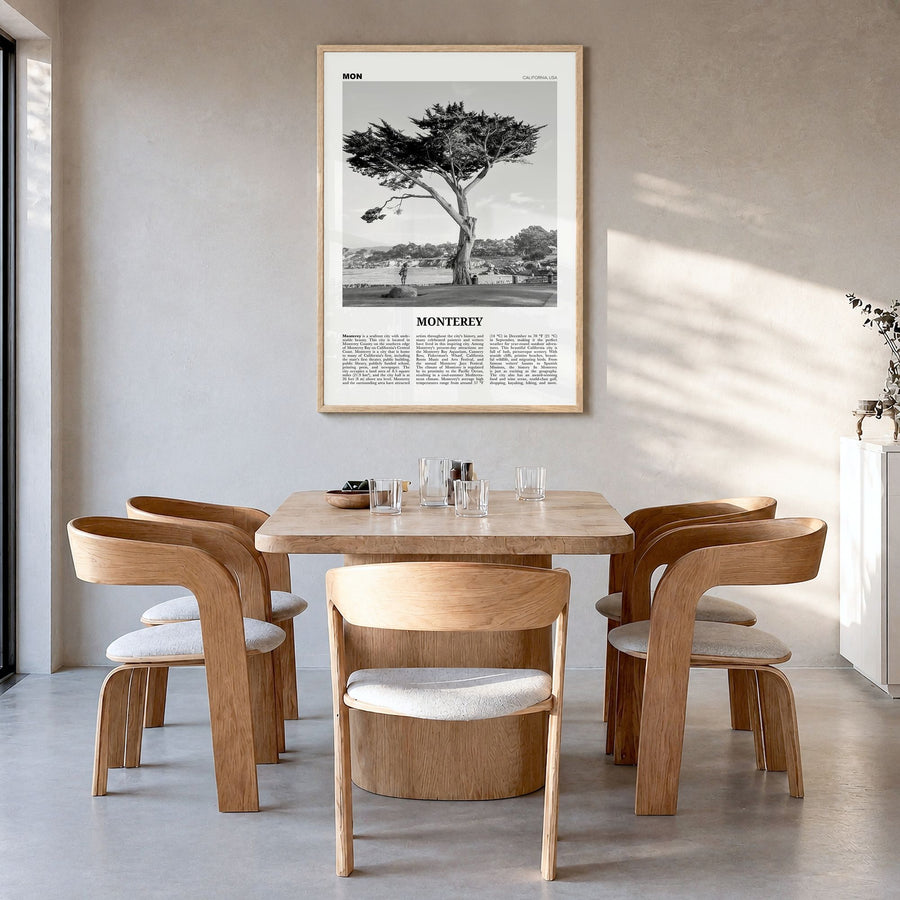 Monterey, California Newspaper Poster in a natural wood frame, hanging in a dining room