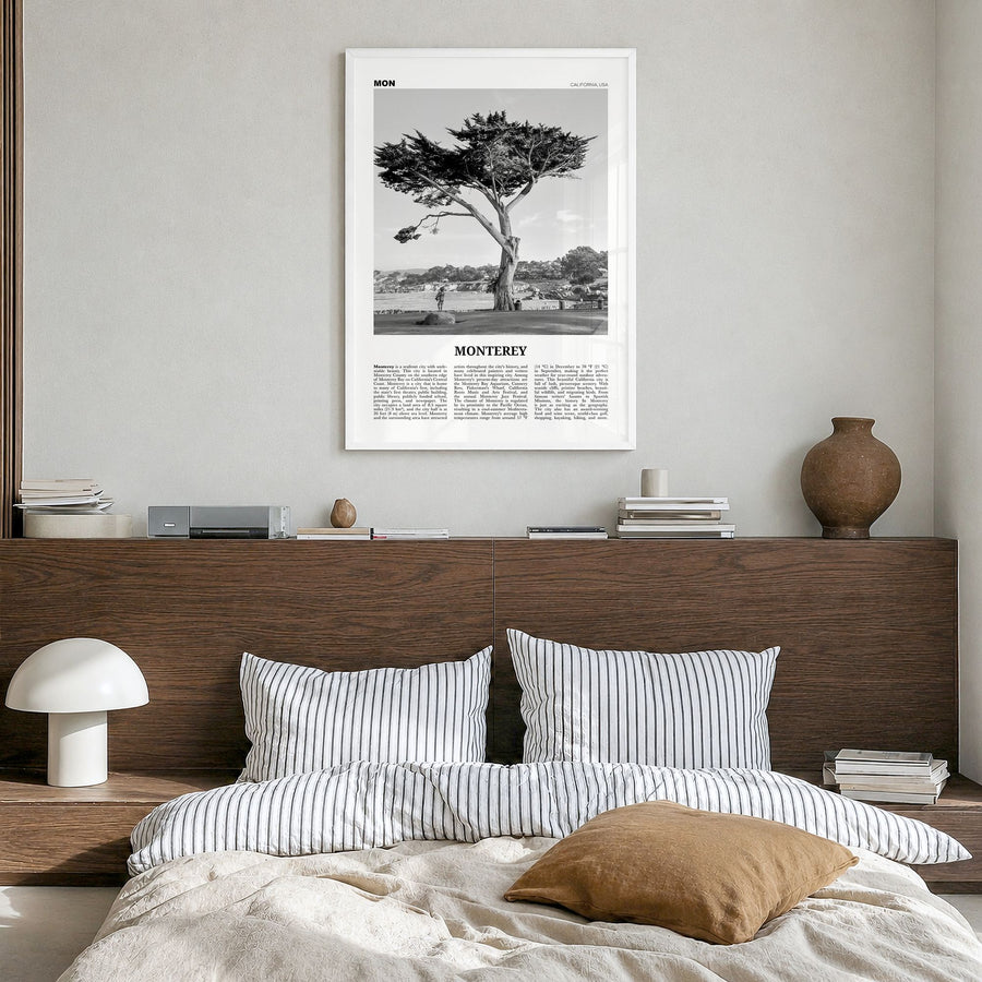 Monterey, California Newspaper Poster in a white wood frame, hanging in a bedroom