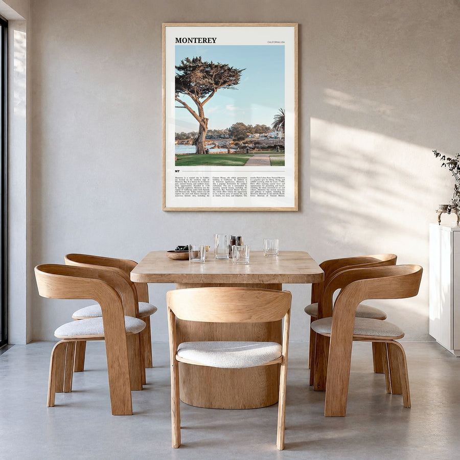 Monterey, California Travel Poster in a natural wood frame, hanging in a dining room