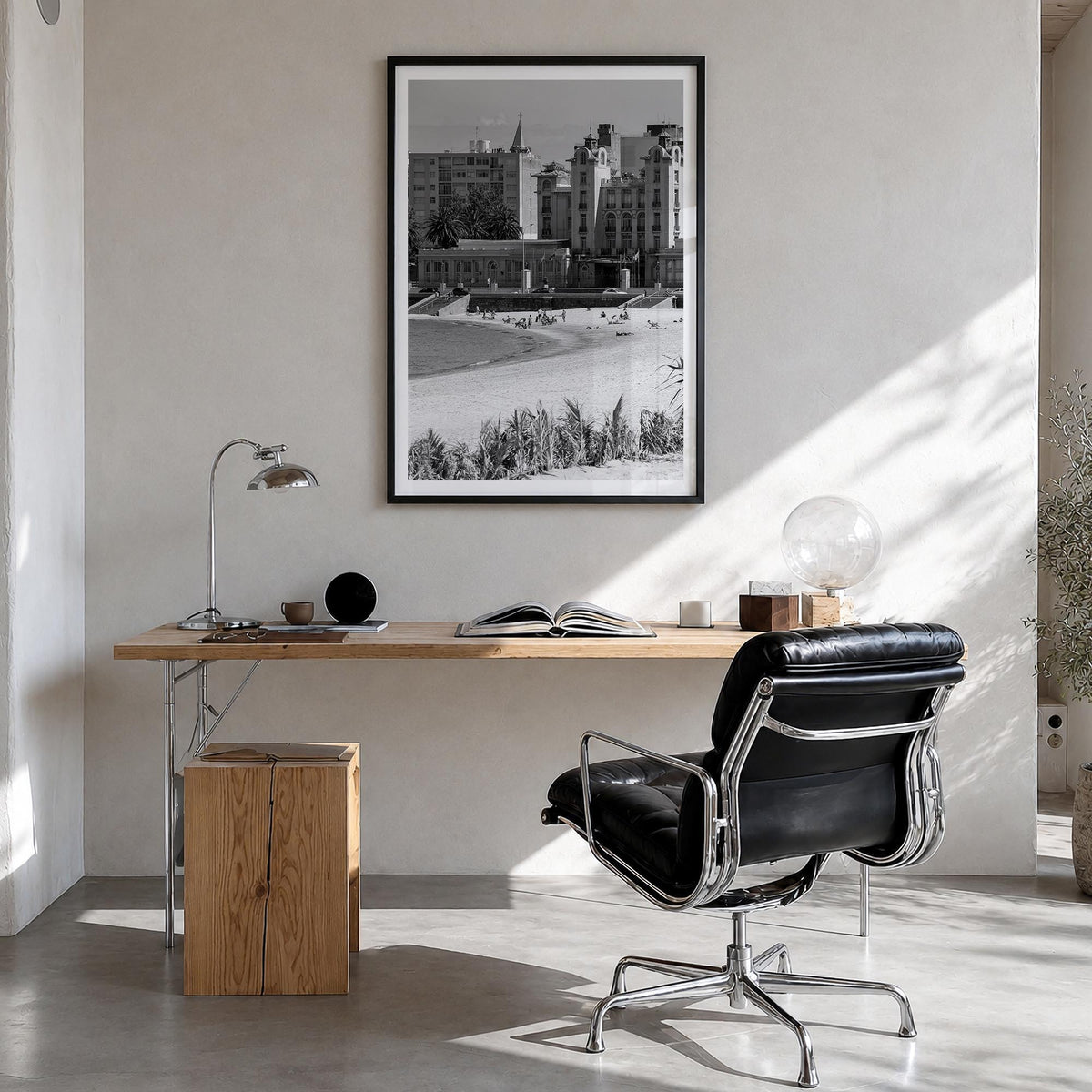 Montevideo black & white photo poster of Uruguay – vertical wall art in black wood frame with white border, hanging on wall