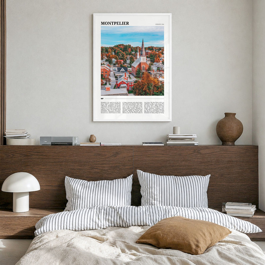 Montpelier Travel Poster in a white wood frame, hanging in a bedroom