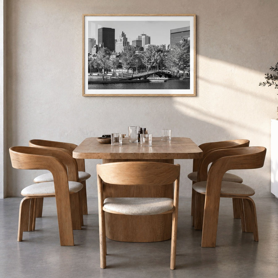 Montreal Photo Poster in a natural wood frame, hanging in a dining room, white border