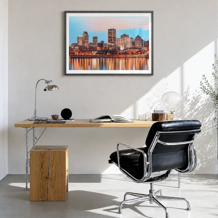 Montreal Photo Poster in a black wood frame, hanging in a bright home office, white border