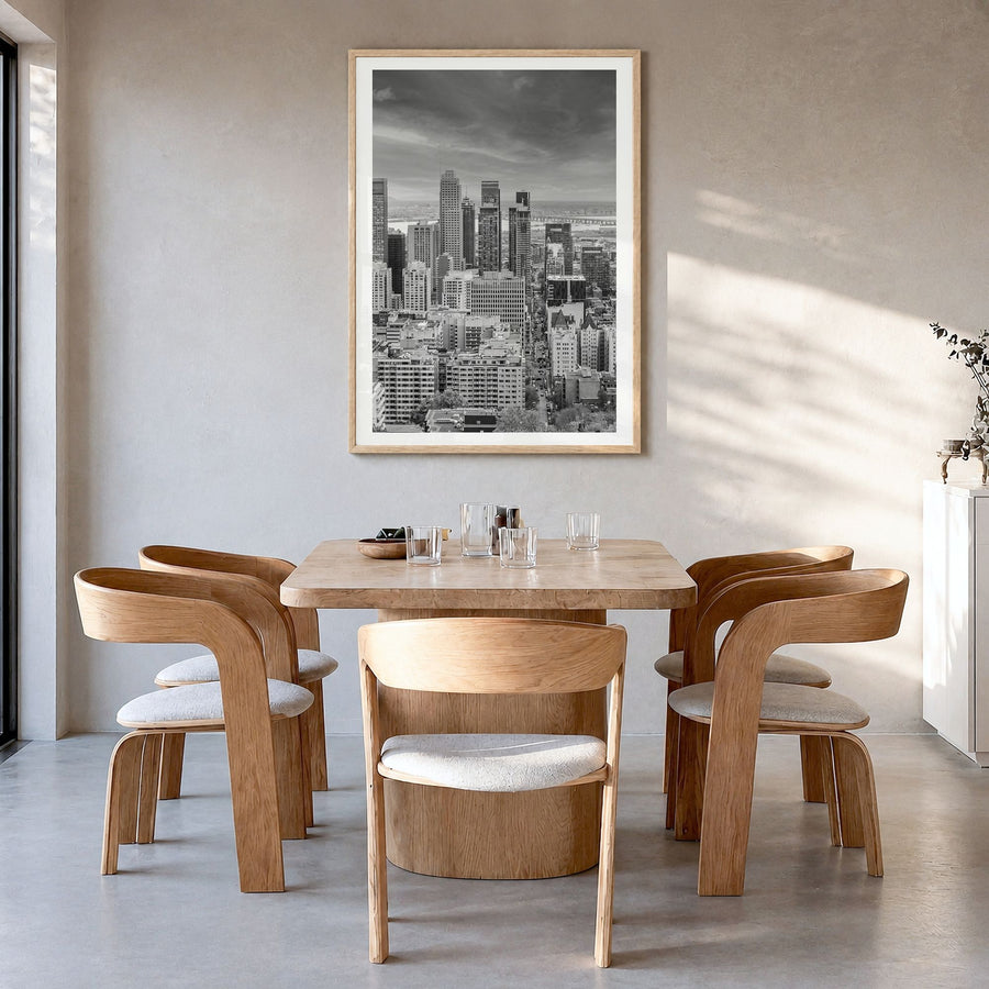 Montreal Photo Poster in a natural wood frame, hanging in a dining room, white border