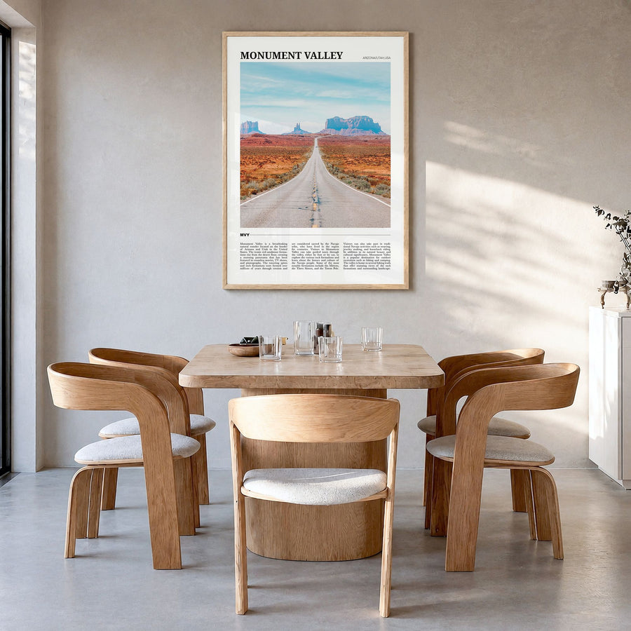 Monument Valley Travel Poster in a natural wood frame, hanging in a dining room