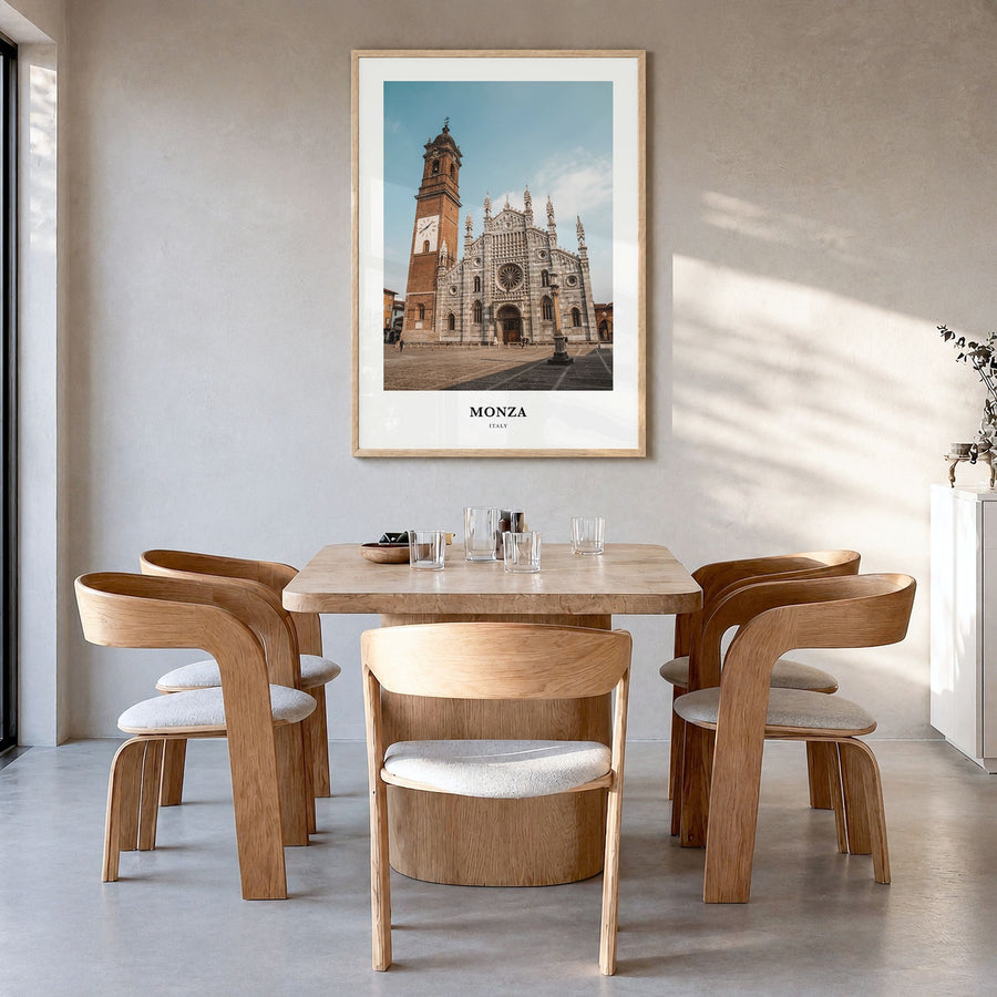 Monza Classic Poster in a natural wood frame, hanging in a dining room