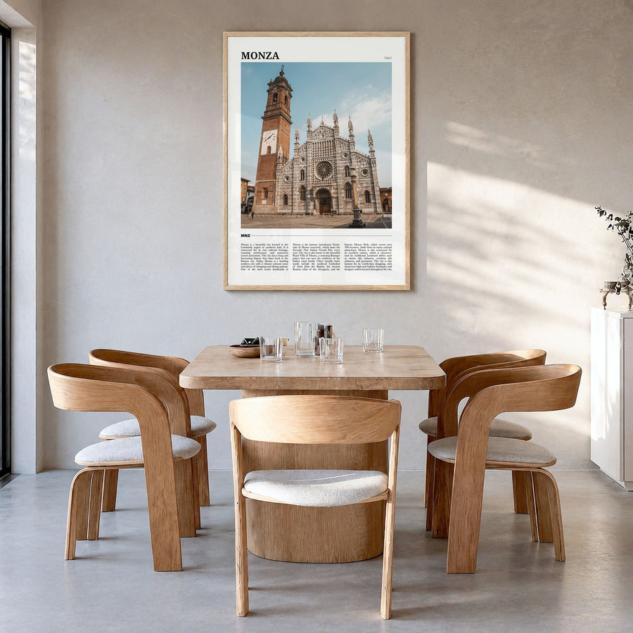 Monza Travel Poster in a natural wood frame, hanging in a dining room