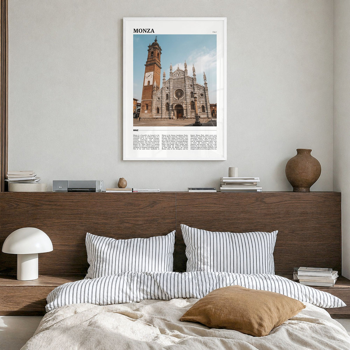 Monza Travel Poster in a white wood frame, hanging in a bedroom