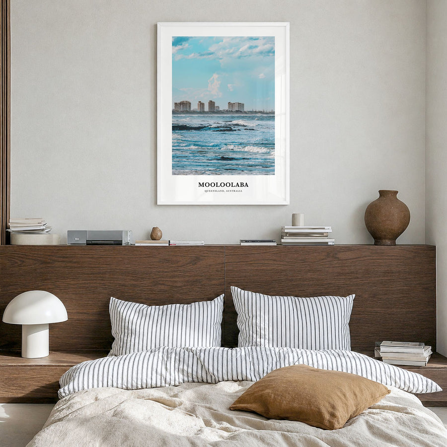 Mooloolaba Classic Poster in a white wood frame, hanging in a bedroom