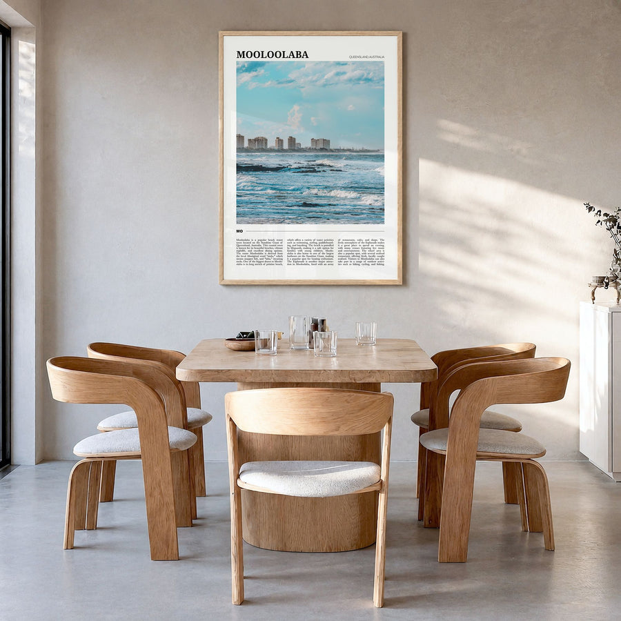 Mooloolaba Travel Poster in a natural wood frame, hanging in a dining room