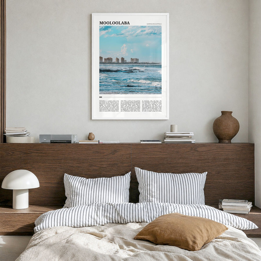 Mooloolaba Travel Poster in a white wood frame, hanging in a bedroom