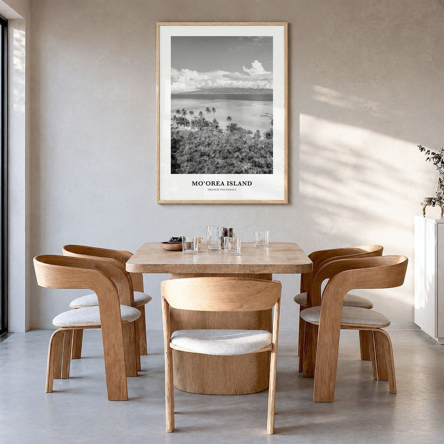Moorea Island Classic Poster in a natural wood frame, hanging in a dining room