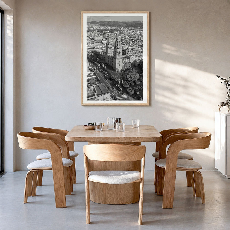 Morelia Photo Poster in a natural wood frame, hanging in a dining room, white border