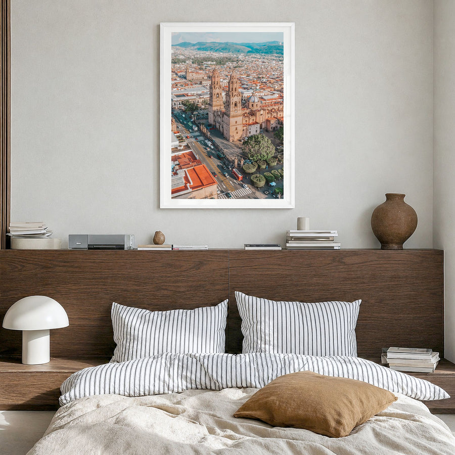 Morelia Photo Poster in a white wood frame, hanging in a bedroom, white border