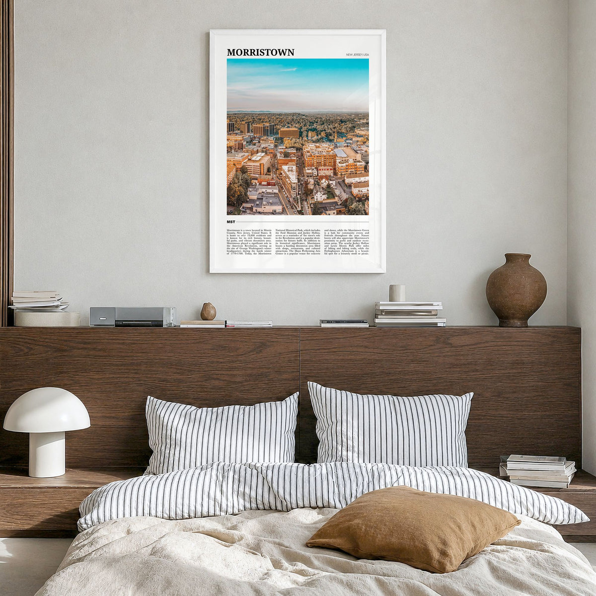 Morristown Travel Poster in a white wood frame, hanging in a bedroom