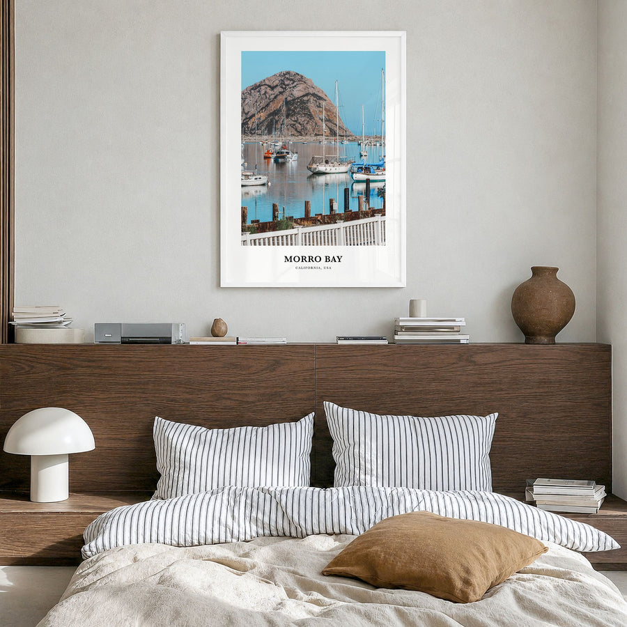Morro Bay Classic Poster in a white wood frame, hanging in a bedroom
