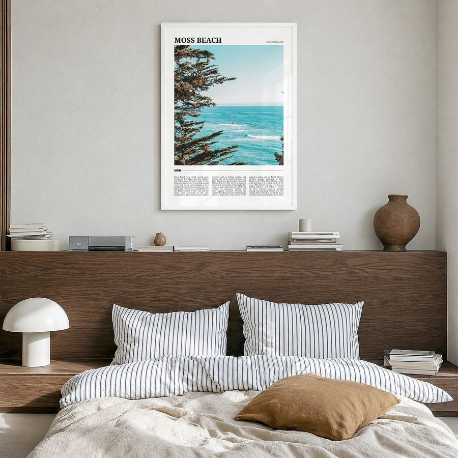 Moss Beach Travel Poster in a white wood frame, hanging in a bedroom