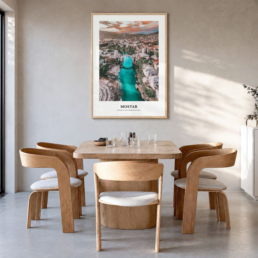Mostar Classic Poster in a natural wood frame, hanging in a dining room
