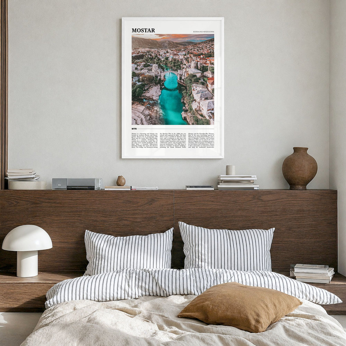 Mostar Travel Poster in a white wood frame, hanging in a bedroom