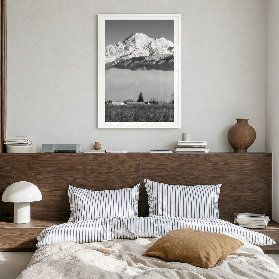 Mount Baker Photo Poster in a white wood frame, hanging in a bedroom, white border