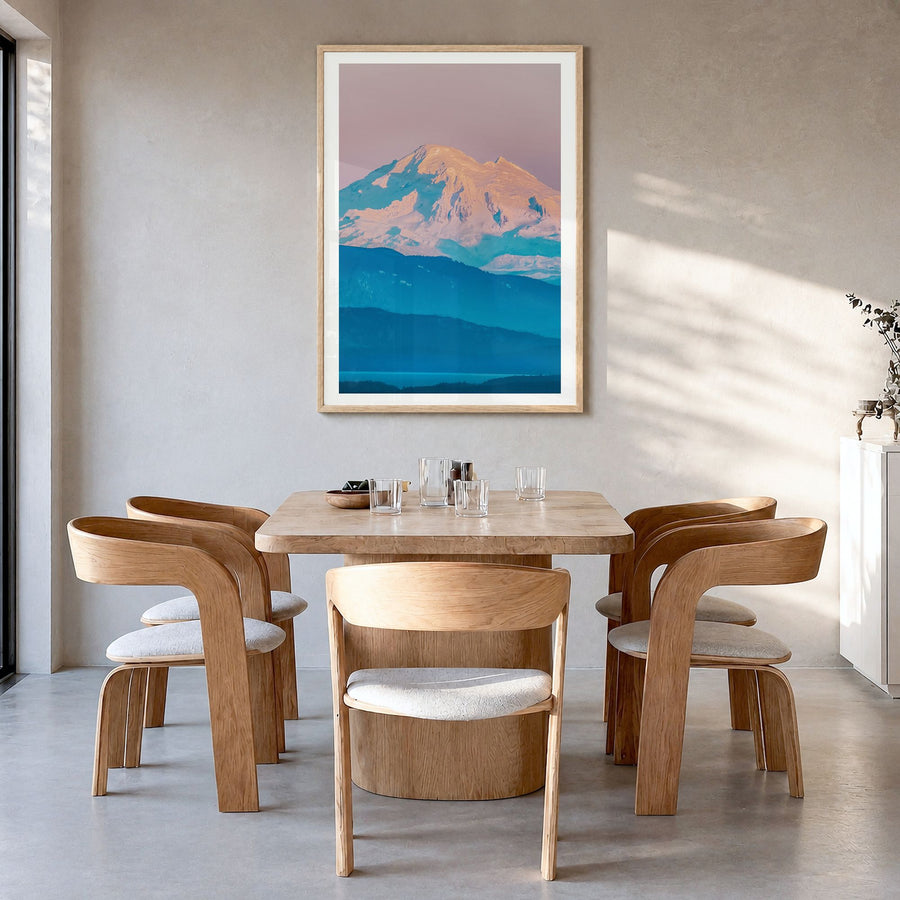 Mount Baker Photo Poster in a natural wood frame, hanging in a dining room, white border