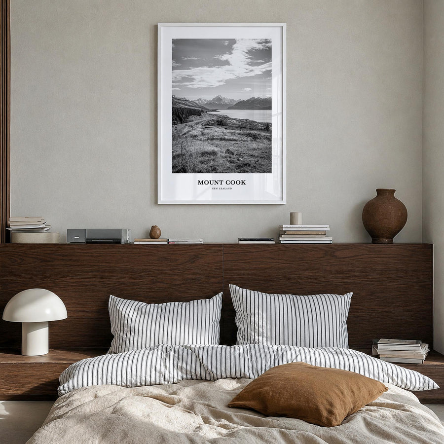 Mount Cook black & white classic poster of New Zealand – vertical wall art in white wood frame, hanging on wall