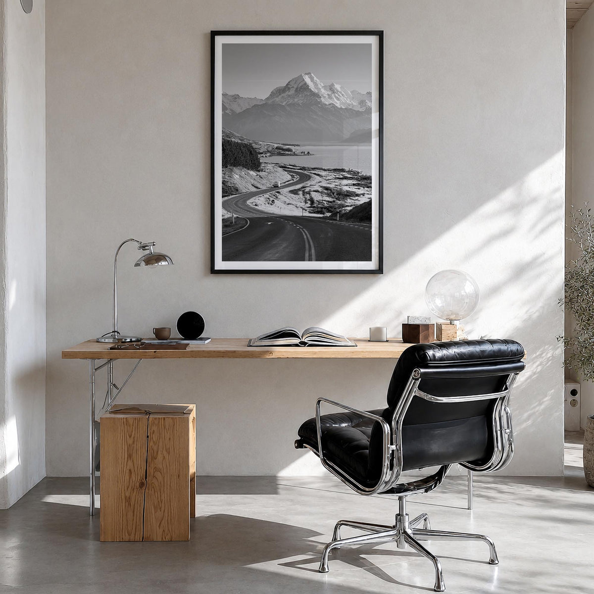 Mount Cook black & white photo poster of New Zealand – vertical wall art in black wood frame with white border, hanging on wa