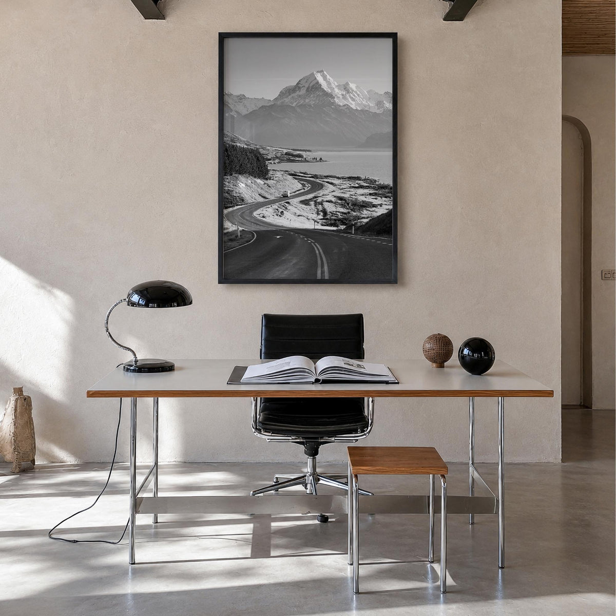 Mount Cook black & white photo poster of New Zealand – vertical wall art in black wood frame, hanging on wall