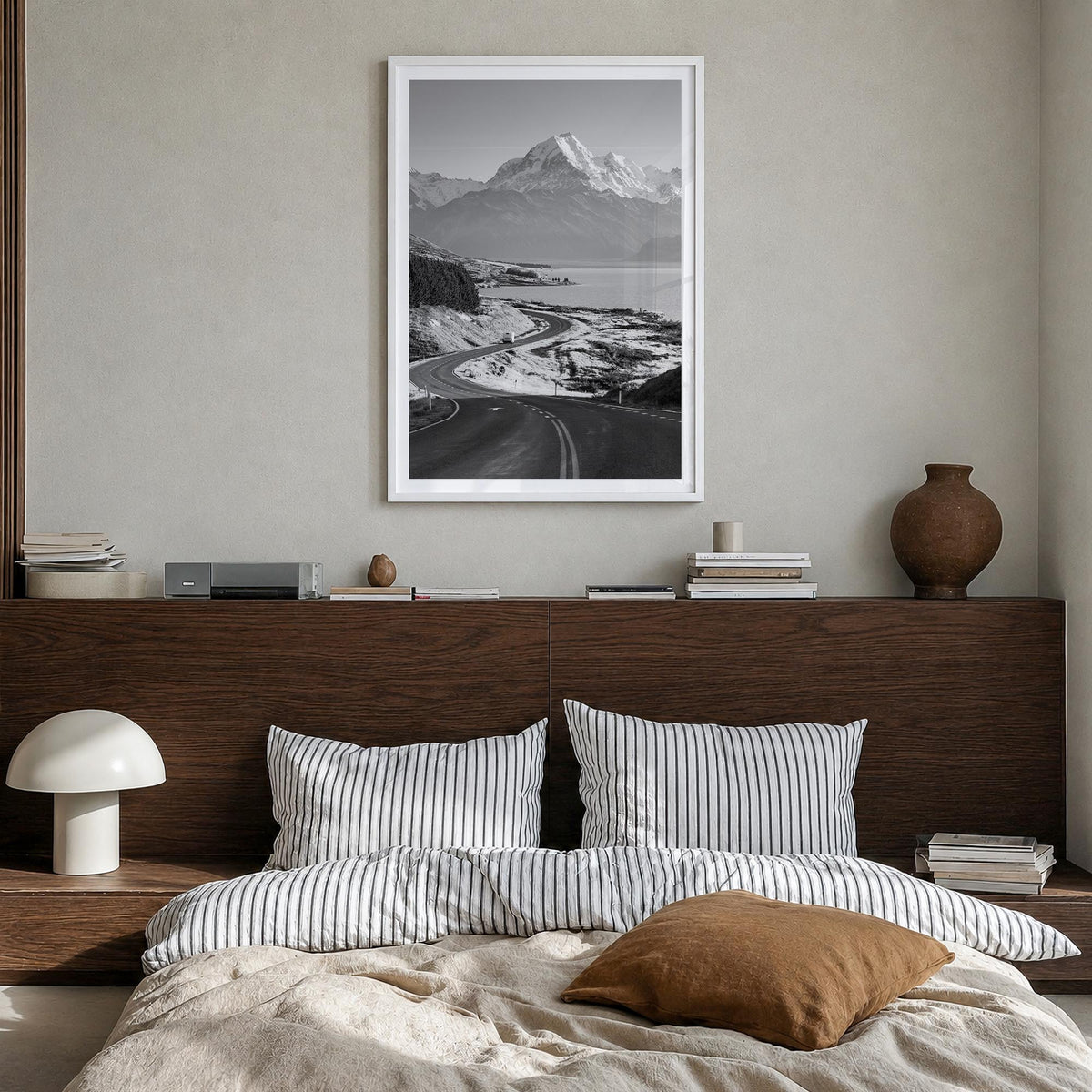 Mount Cook black & white photo poster of New Zealand – vertical wall art in white wood frame with white border, hanging on wa