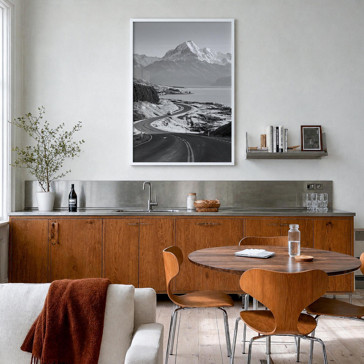 Mount Cook black & white photo poster of New Zealand – vertical wall art in white wood frame, hanging on wall