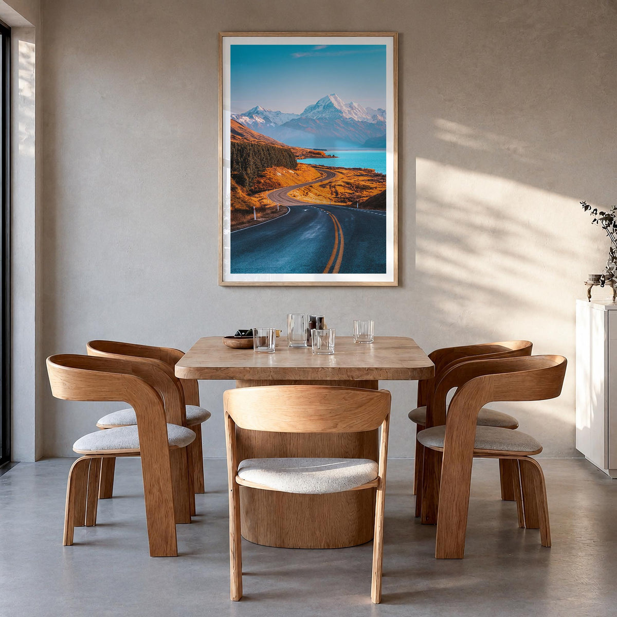 Mount Cook colorful photo poster of New Zealand – vertical wall art in natural wood frame with white border, hanging on wall